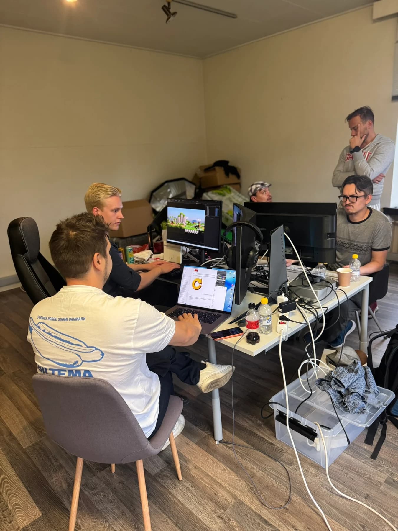 Members of the 2Agree team working around a shared desk